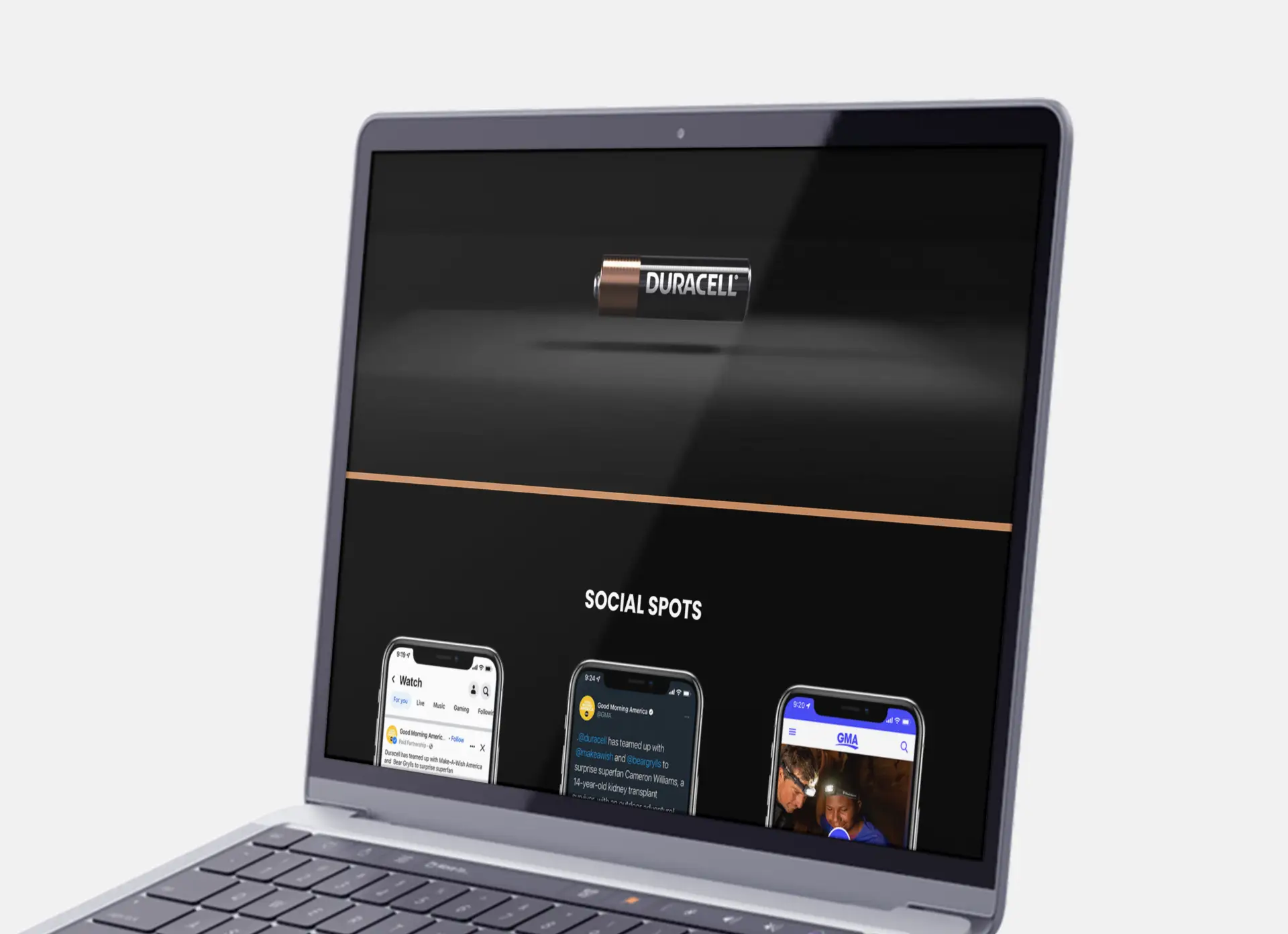 Closeup of a laptop at an angle showcasing an on-page promo video and social posts on the Duracell and Good Morning America (GMA) Partnership website.