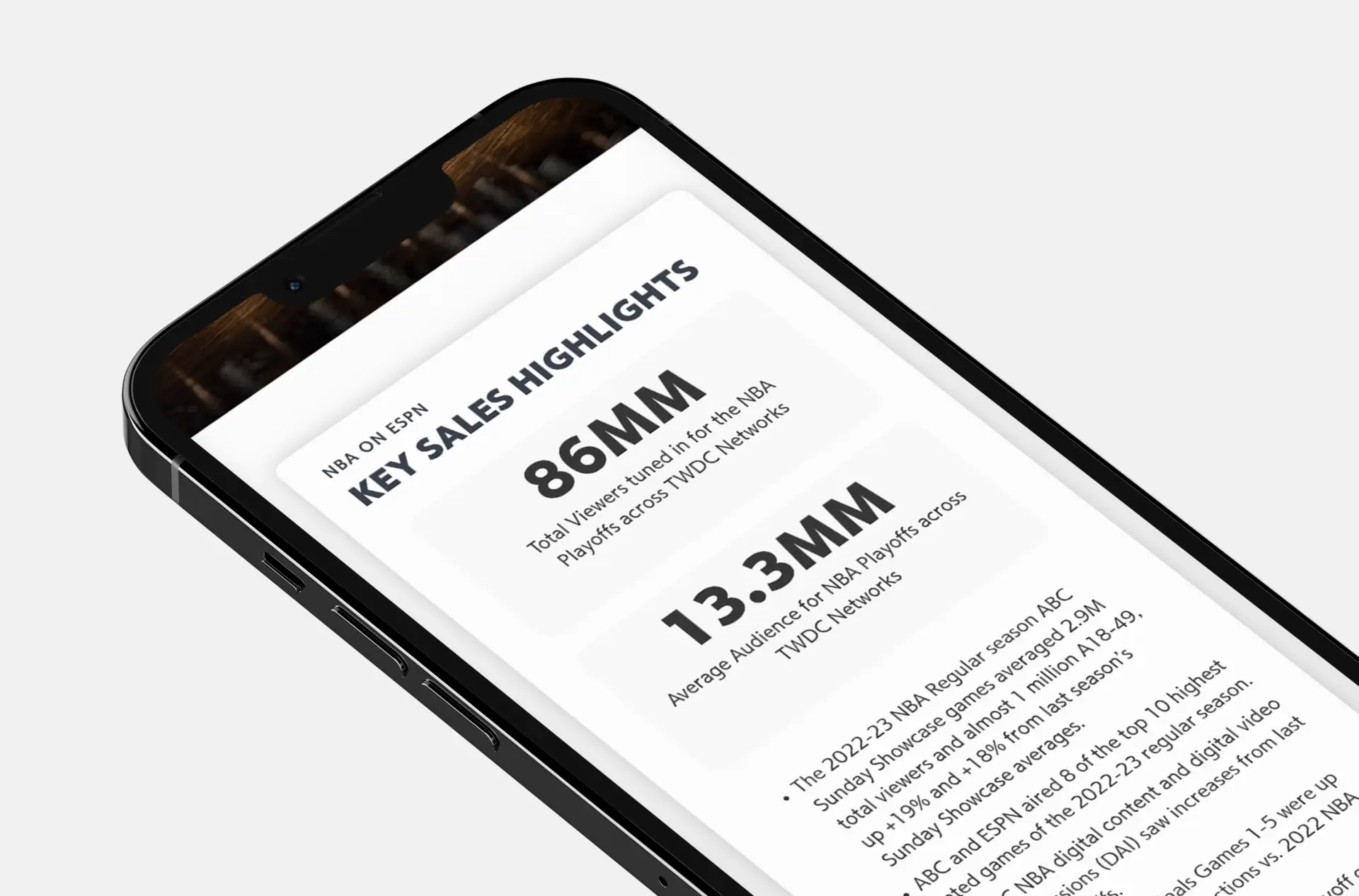 Smartphone showcasing ESPN audience statistics on the new Disney Advertising Weekly Topline Report website