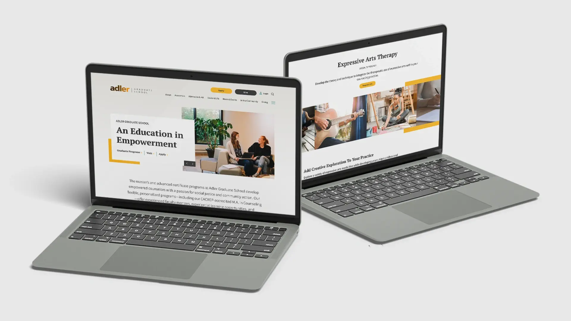 Two laptops side by side with the new Adler Graduate School website displayed on the screen.